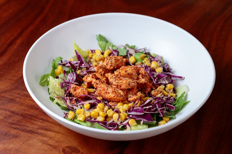 Chicken Taco Bowl with lettuce base and house dressing