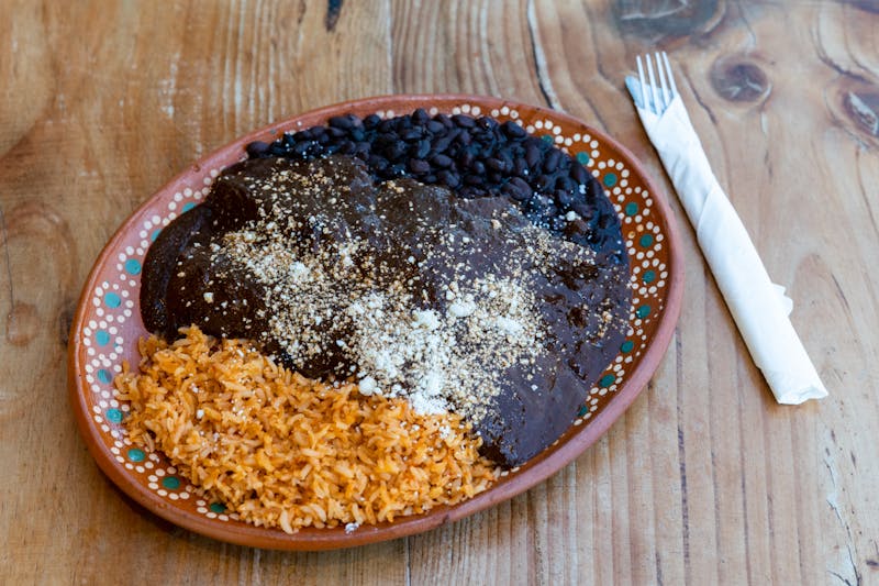 Refried Beans and Rice side dish with toppings