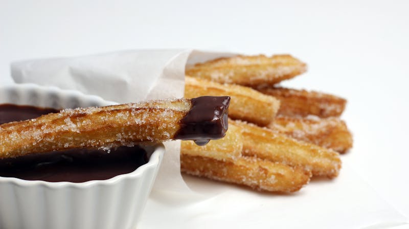 Churros with chocolate dipping sauce and cinnamon sugar